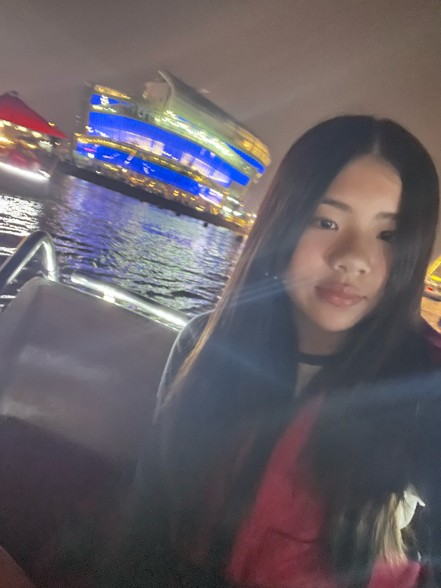 Zheng posing in a boat on Han River.
