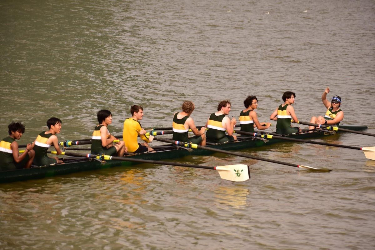 The Men’s Varsity 8 rowing back after crossing the finish line, taking second place. 
