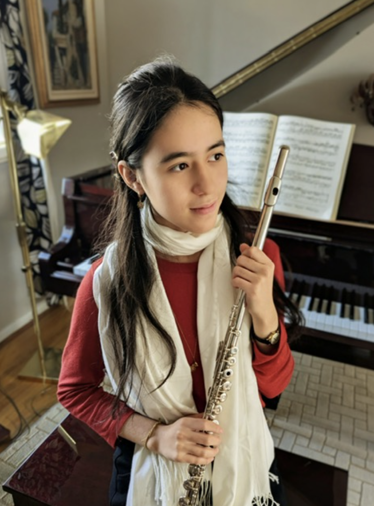 Riccardi with her flute, practicing for a solo. Photo courtesy of Riccardi