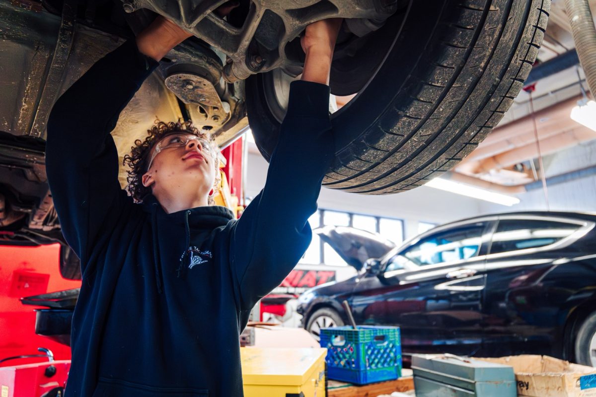 Senior Deacon Bochenek works on a car in Auto Services Technology.