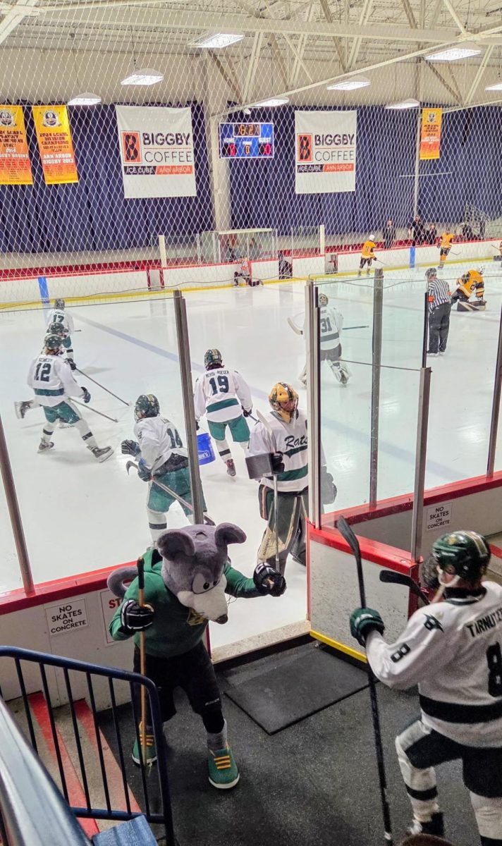 Rats storming the ice before their victory against Bishop Foley. Photo courtesy of Tabitha Bohnsack.