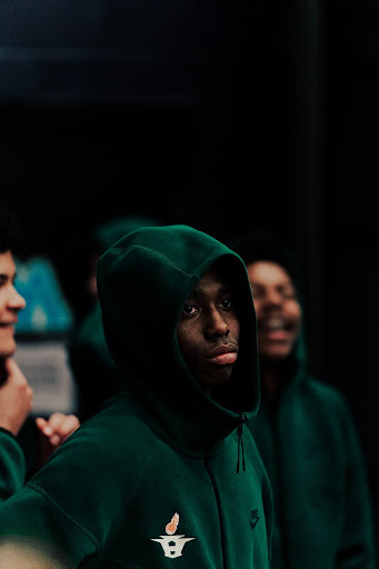 Before the season’s most-anticipated rivalry game, senior Kinley Poole prepares for tip-off at Pioneer High School. In his final game as a senior, he focuses on leading his team with determination and pride.