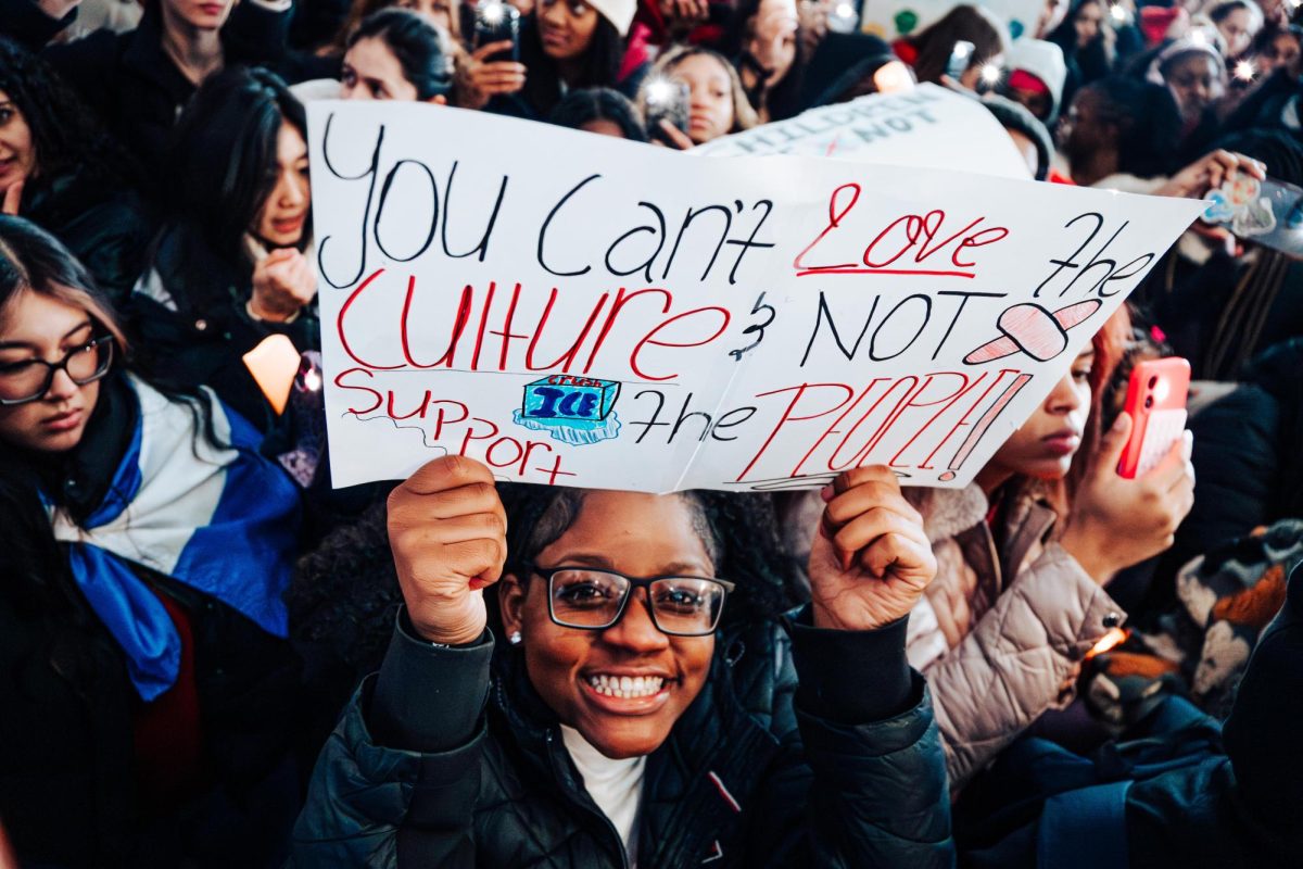 "You can't love the culture & not support the people," a sign read.
