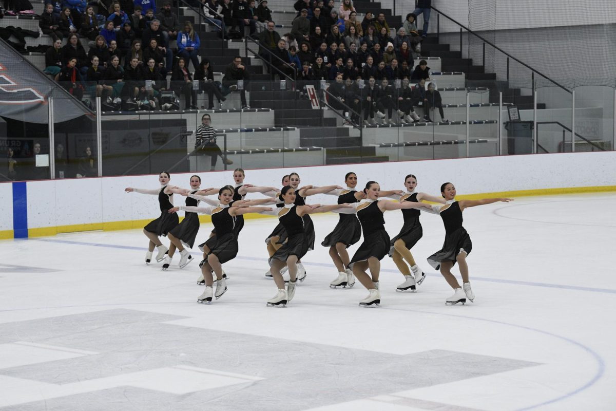 Sophomore Janet Yang skating with her team, the Hockettes, at a competition. Courtesy of Yang.