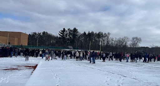 Huron students congregated outside in the football field after the fire alarm.