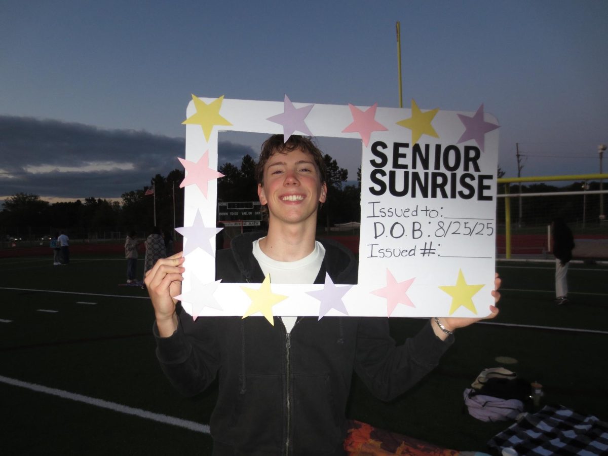 Bunnell posing for a photo at Huron's Senior Sunrise event. Courtesy of Bunnell. 