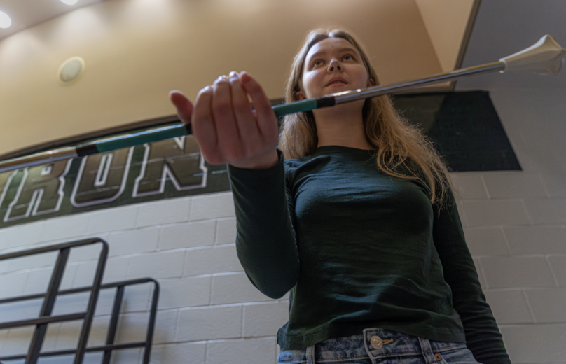 Sweet holding the baton. The baton should be the length from armpit to fingertips.