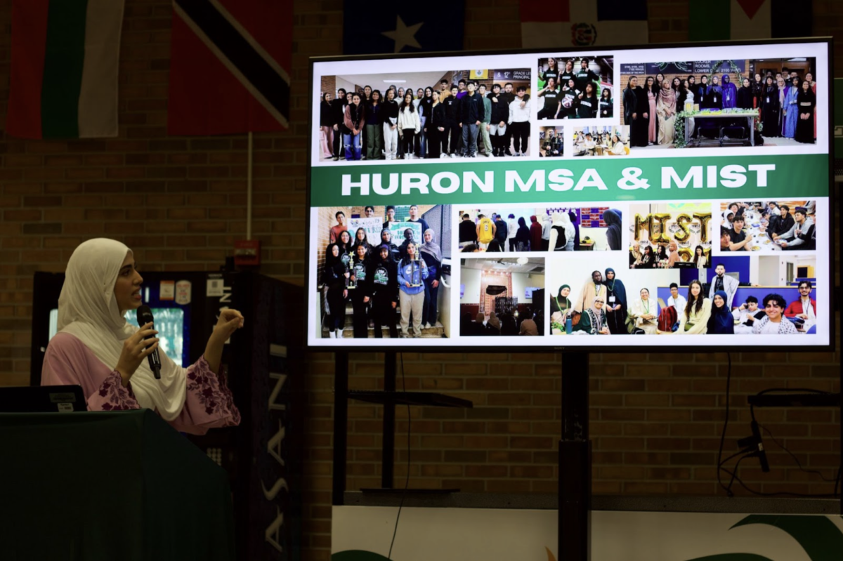 Junior Karma Ismail delivers a presentation about MSA, what the Huron MSA club has done, and its future plans.