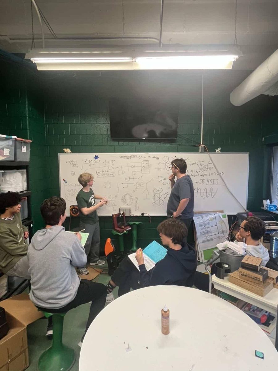 Seniors Jack Rozenburg and Isaac Thomas work out a problem in Huron's engineering class. Photo courtesy of Rozenburg.