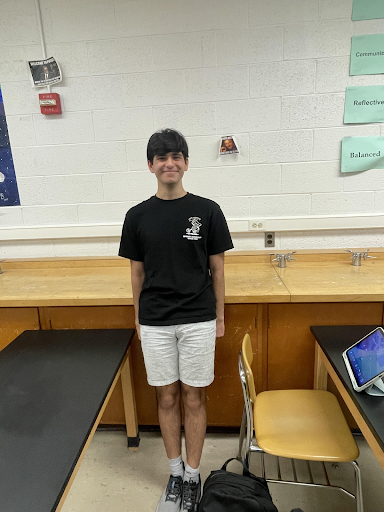 Ahmed posing inside his science class. Courtesy of Ahmed. 