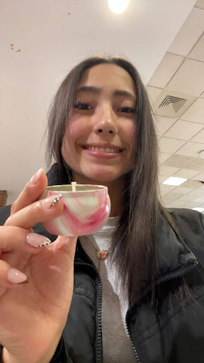 Helme posing with a candle. Courtesy of Helme. 
