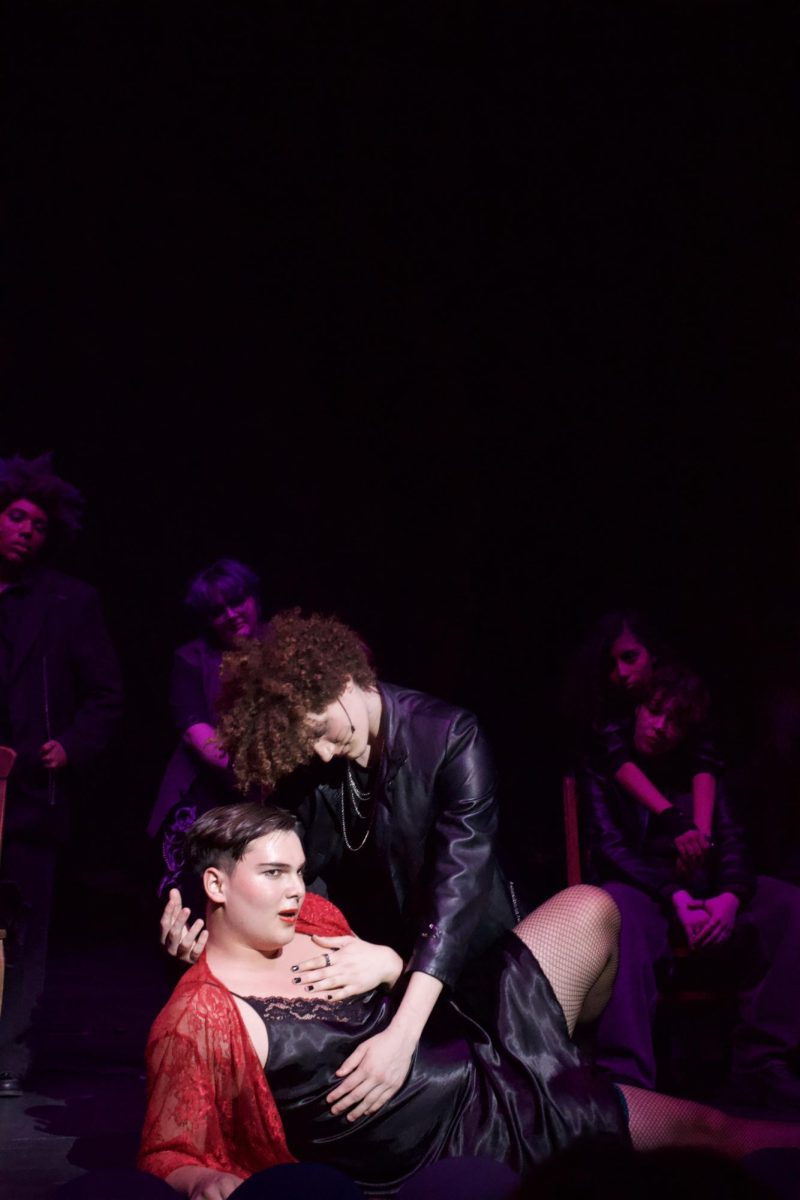 Constantin leans into Pioneer junior Wilhelm Ritter during a performance of Noel’s monologue, capturing the character’s dramatic persona.