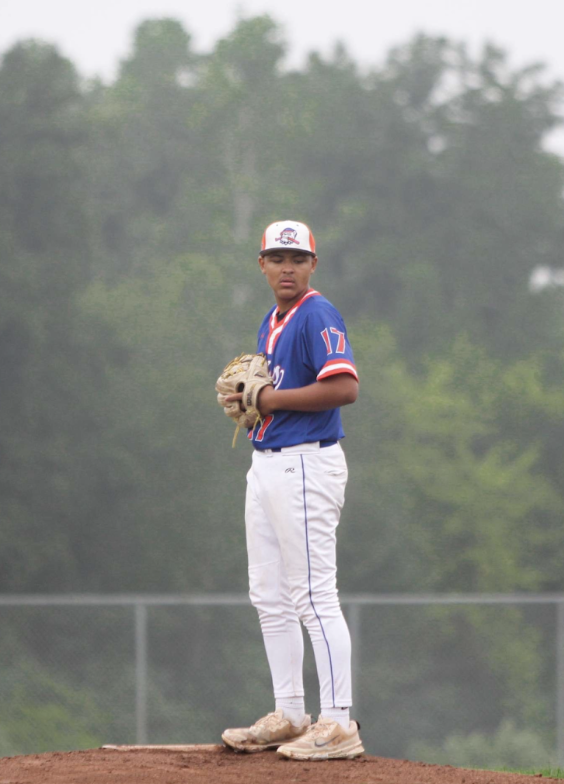Wallace getting ready to throw a pitch in a game for his travel baseball team. Courtesy of Wallace. 