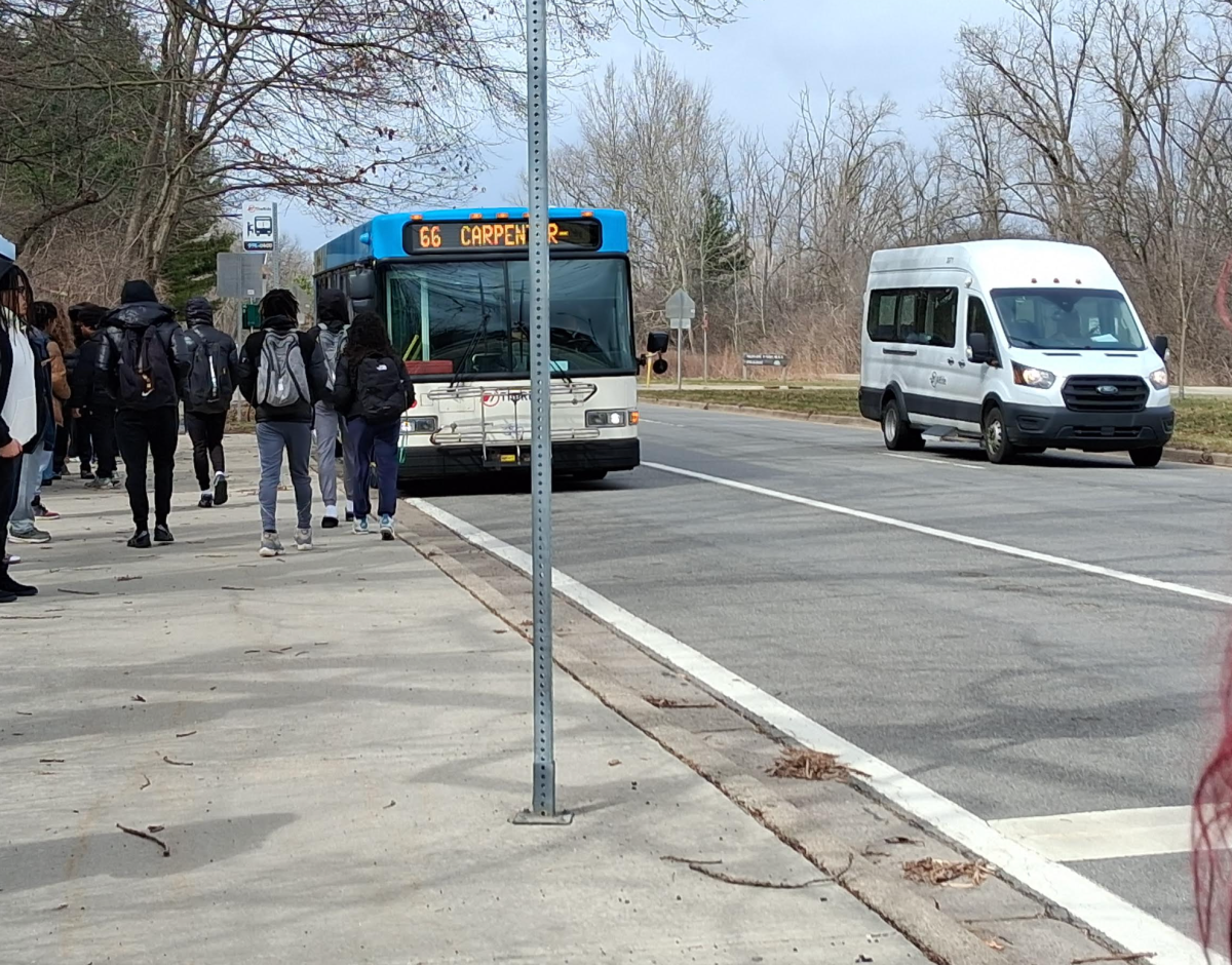 The bus stop outside of Huron's entrance blocks the view of oncoming traffic from pedestrians.
